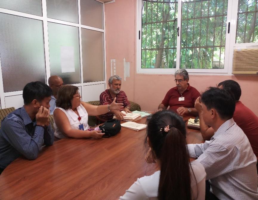 A group of people sitting around a tableDescription automatically generated